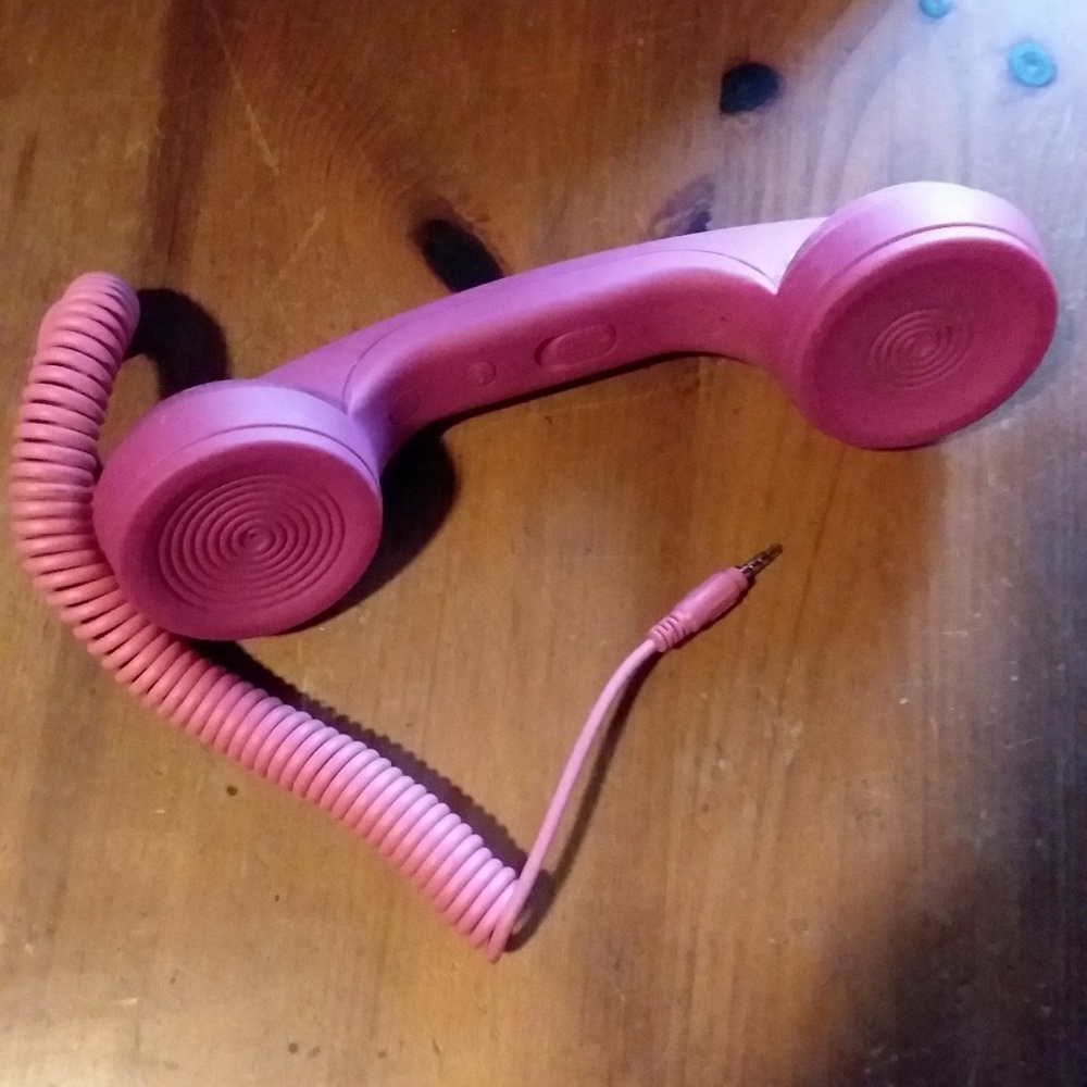 Telephone handset that attaches to cell phone